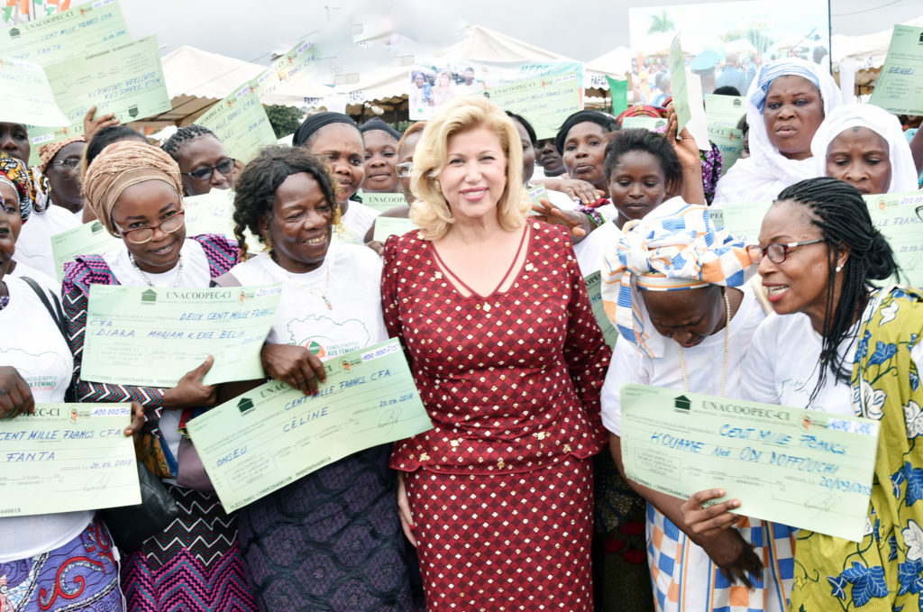 The First Lady gives checks and make donations to women in Abidjan